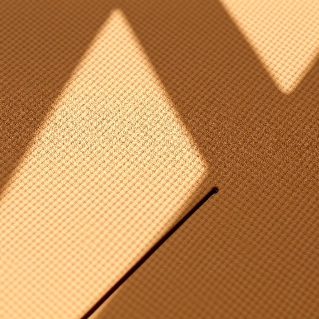 Close-up of the textured non-slip surface and cut edge of the 6 mm yoga mat